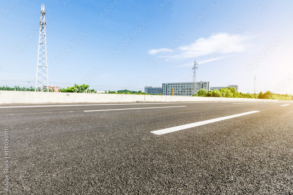 The new asphalt road under the blue sky