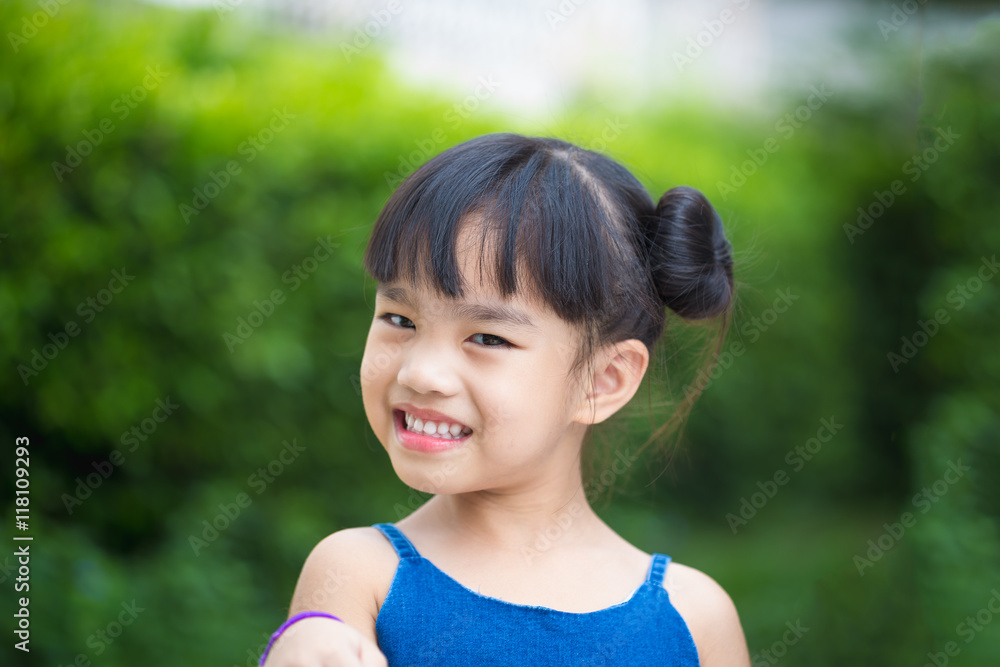 Happy little girl having fun at the park