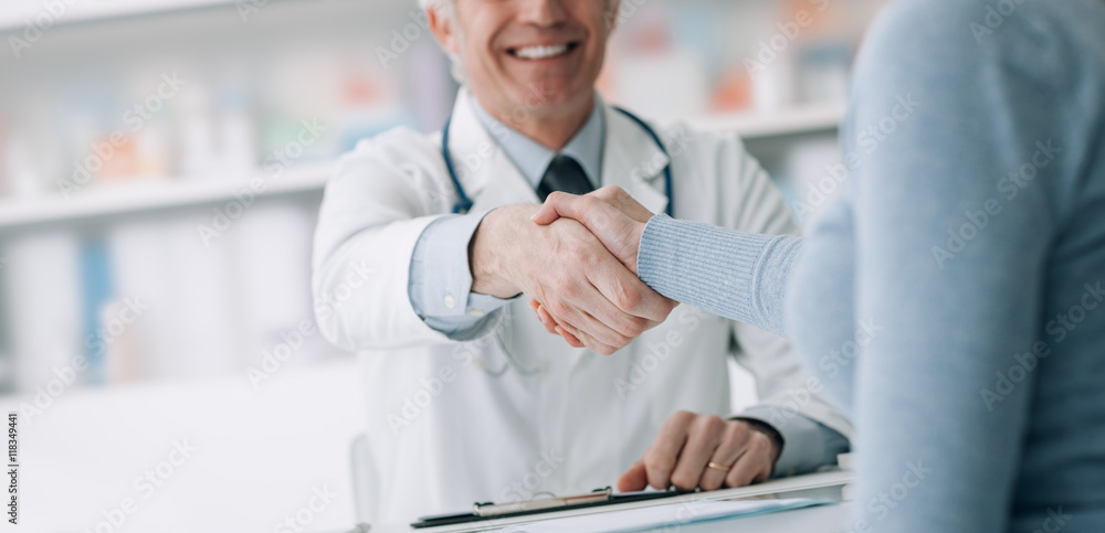 Doctor and patient shaking hands