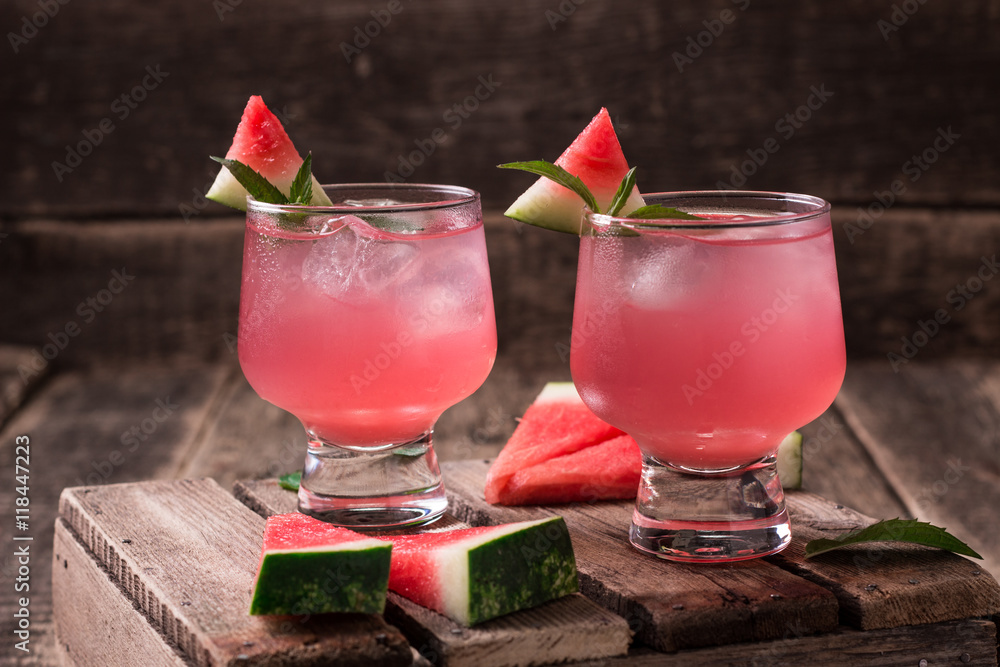 Watermelon drink in glasses with slices of watermelon mint and lemon, vintage background ,soft focus