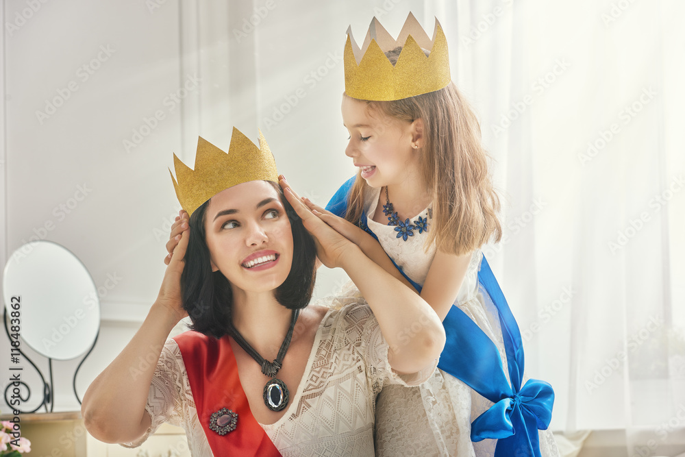 queen and princess in gold crowns