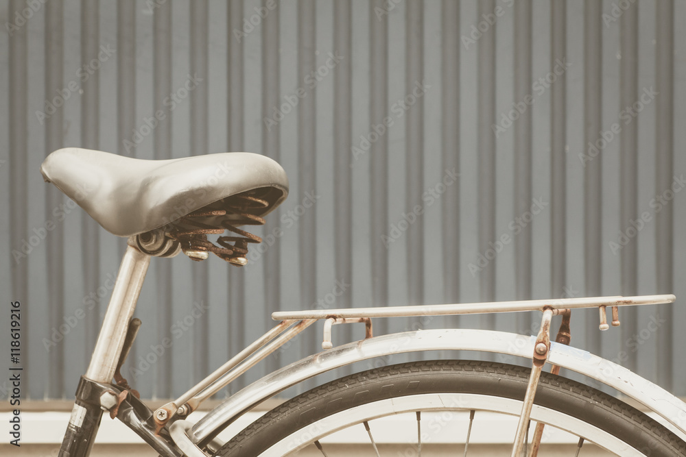 Close - up Black leather saddle and stacks bike