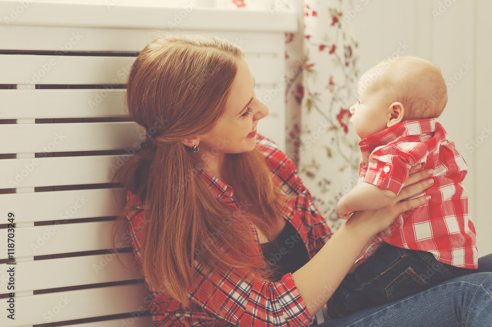 happy family mother and baby playing at home