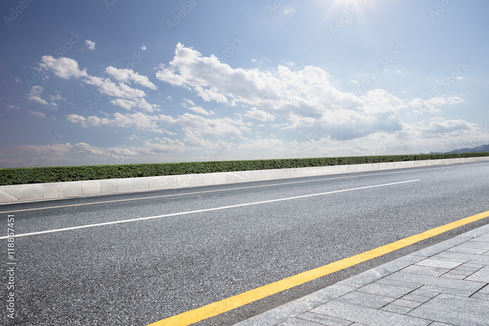 empty rural asphalt road in sunny day