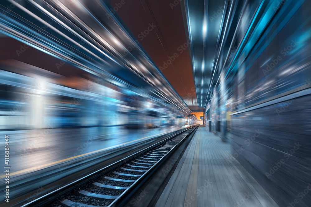 Railway station at night with motion blur effect. Railroad