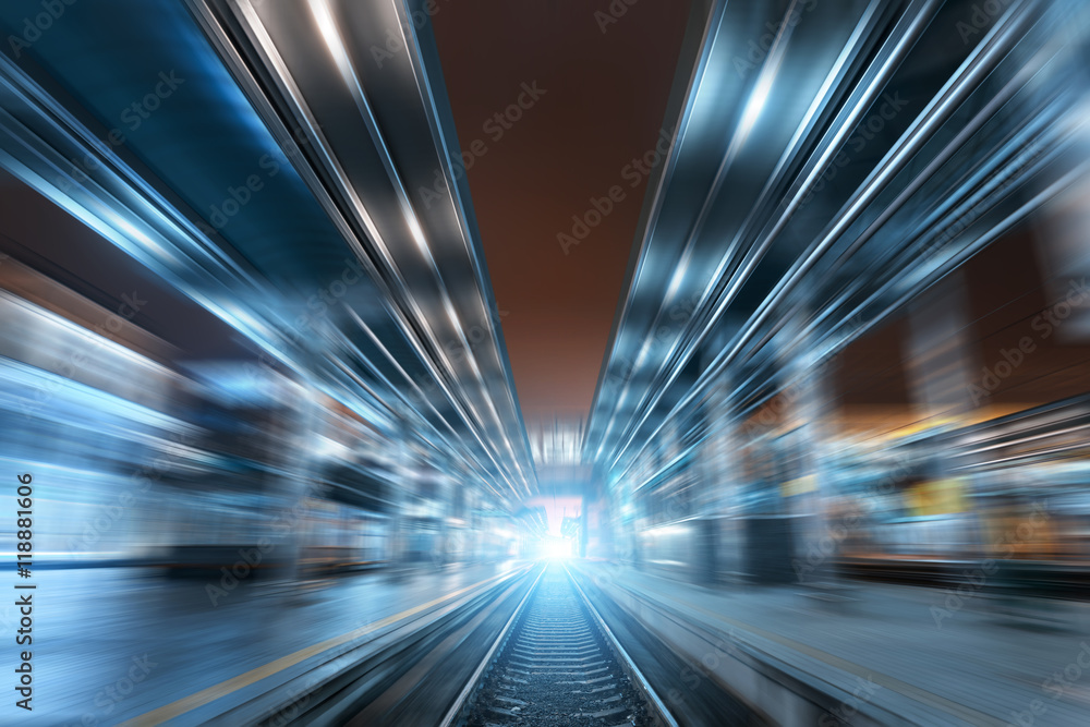 Railway station at night with motion blur effect. Railroad