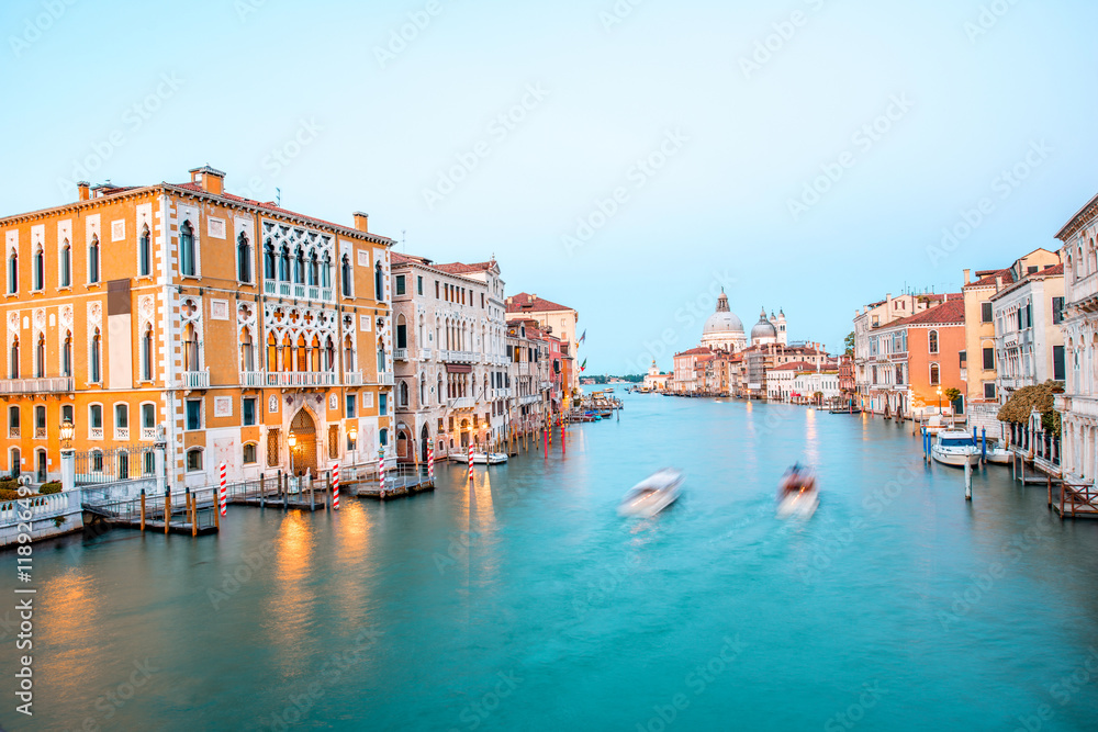 View on illuminated Grand canal with Santa Maria basilica from Accademic bridge at the dusk in Venic