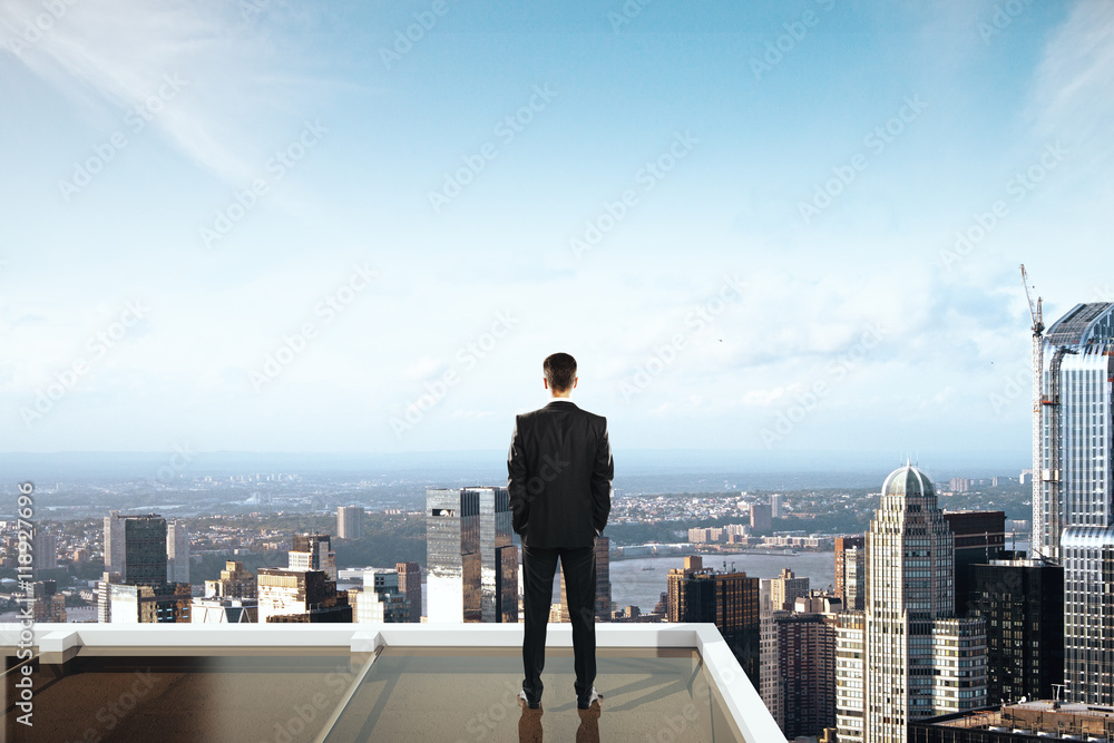 Businessman looking at city