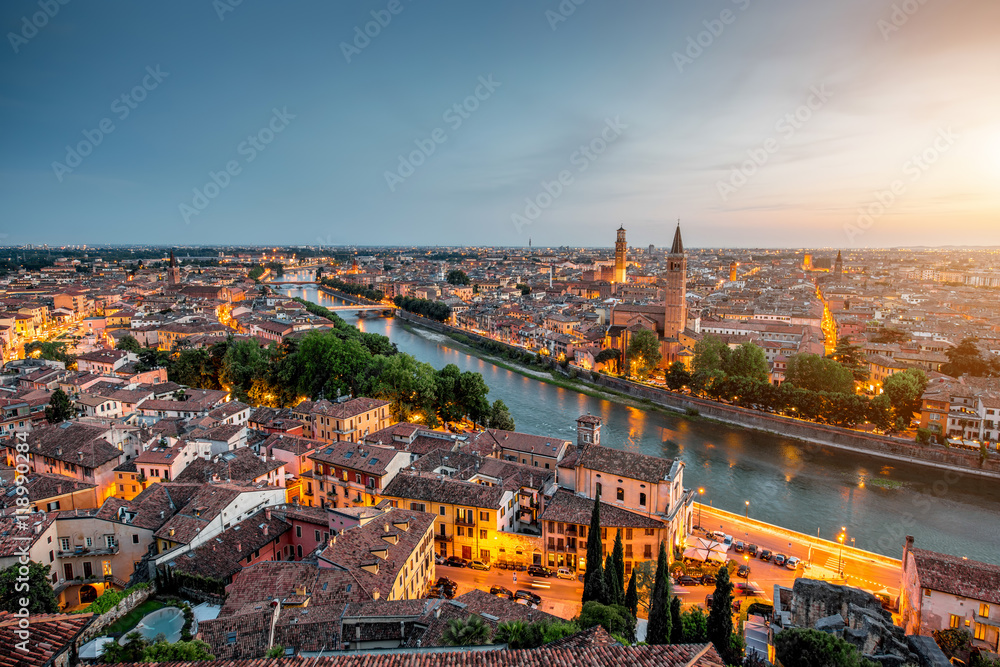 Verona panoramic aerial view on illuminated old town on the sunset in Italy