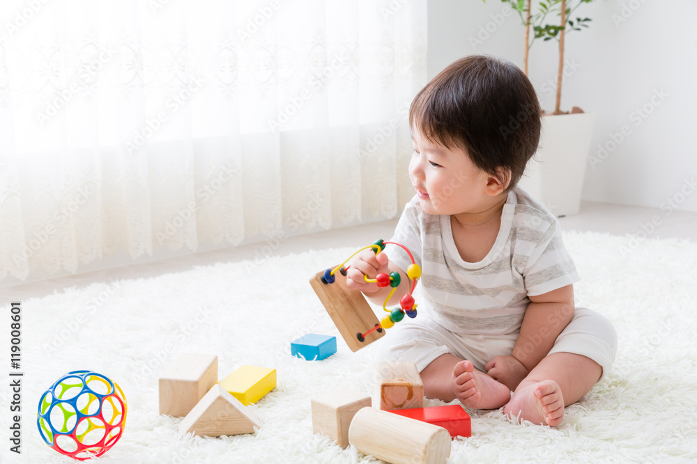 portrait of asian baby playing