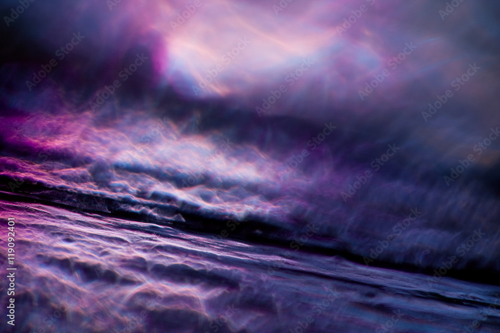 Abstract background in the form of sparkling violet plasma.