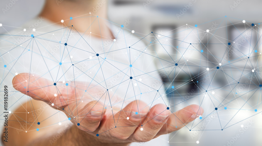 Businessman holding digital data network in his hand