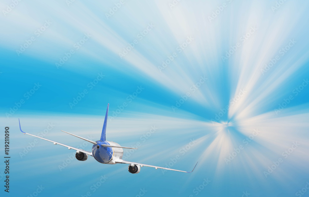 Airplane with background of sunburst sky at sunset or sunrise, e