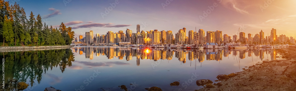 Beautiful Vancouver skyline and harbor area in golden evening light, Canada