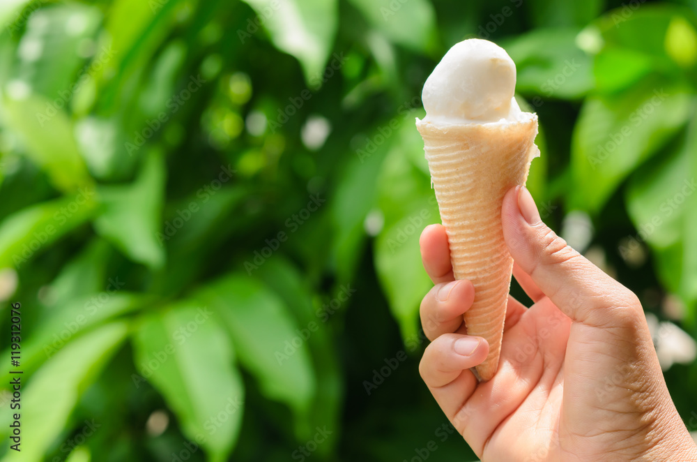 icecream on hand background green leaf