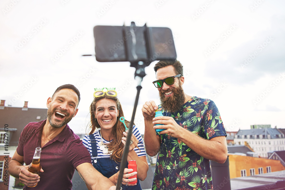 Partying friends taking pictures of themselves