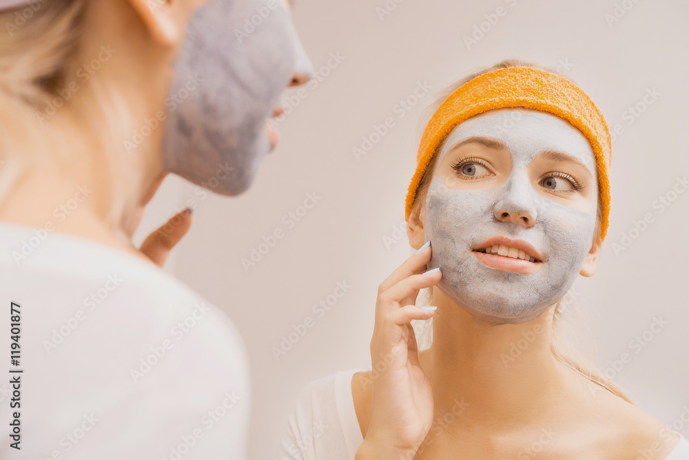 Woman applying mask