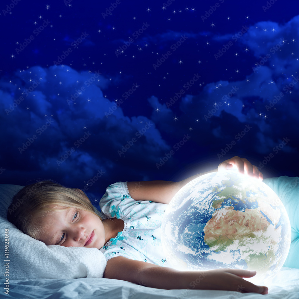 Girl in her bed and glowing globe