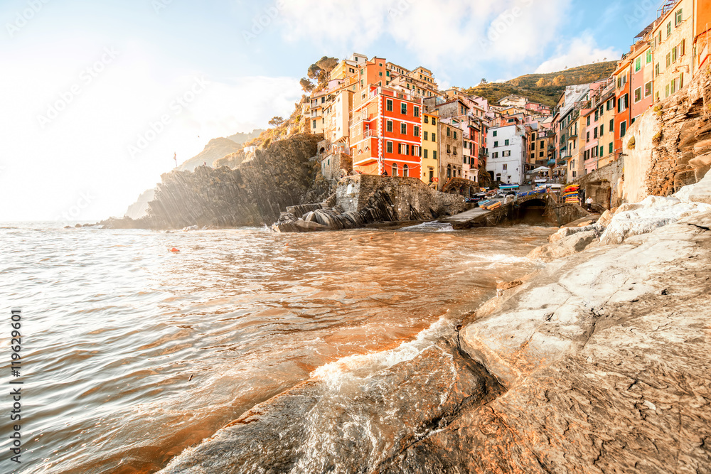 Landscape view on the old coastal famous town Riomaggiore in the small valley in the Liguria region 