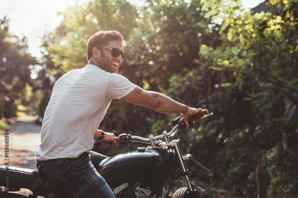 Handsome young man on motorcycle