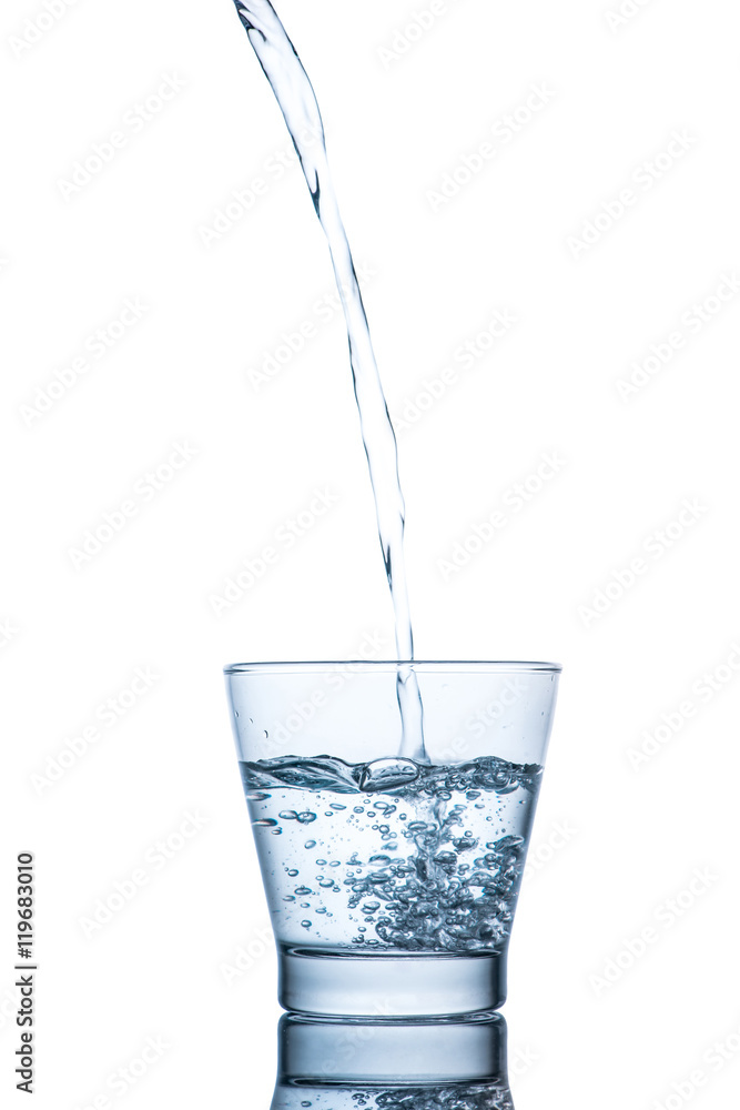 Drinking water is poured into a glass