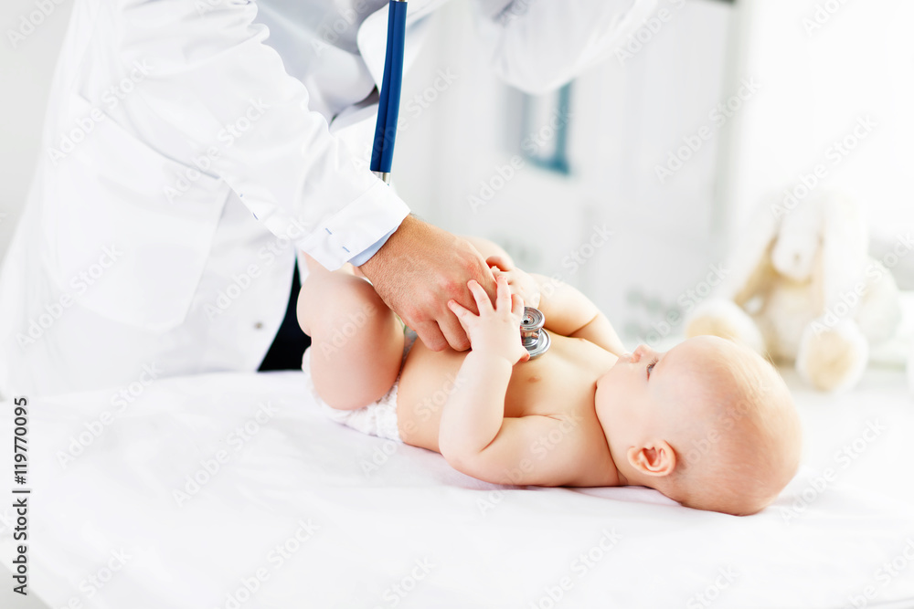 Doctor pediatrician stethoscope listening to baby