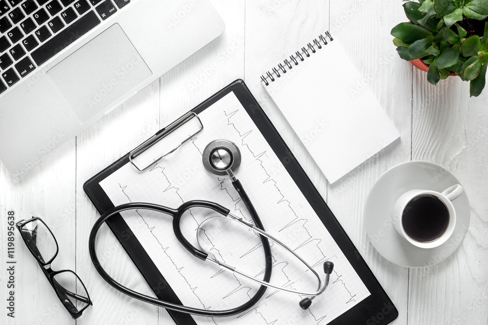 doctor workplace with stethoscope and laptop top view