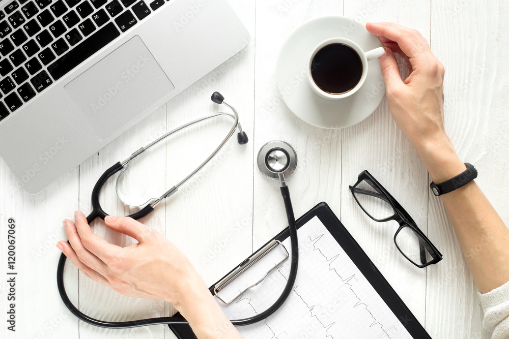 doctor workplace with a stethoscope top view girl hands