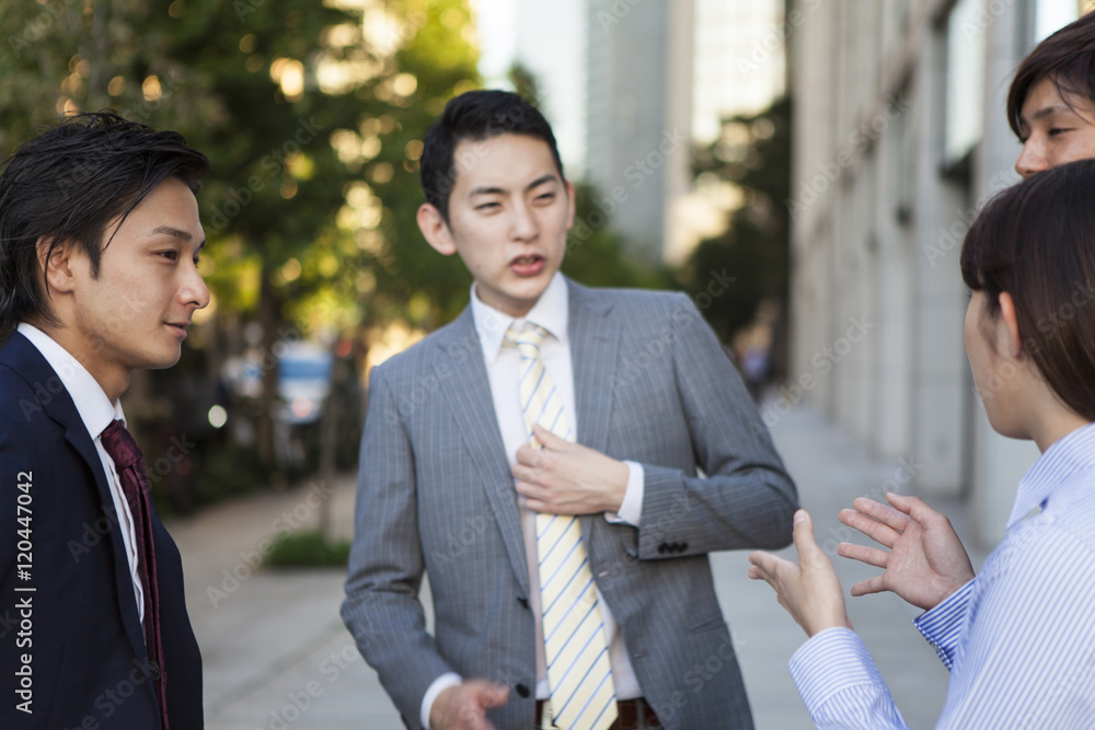 Young business man is talking in the office district