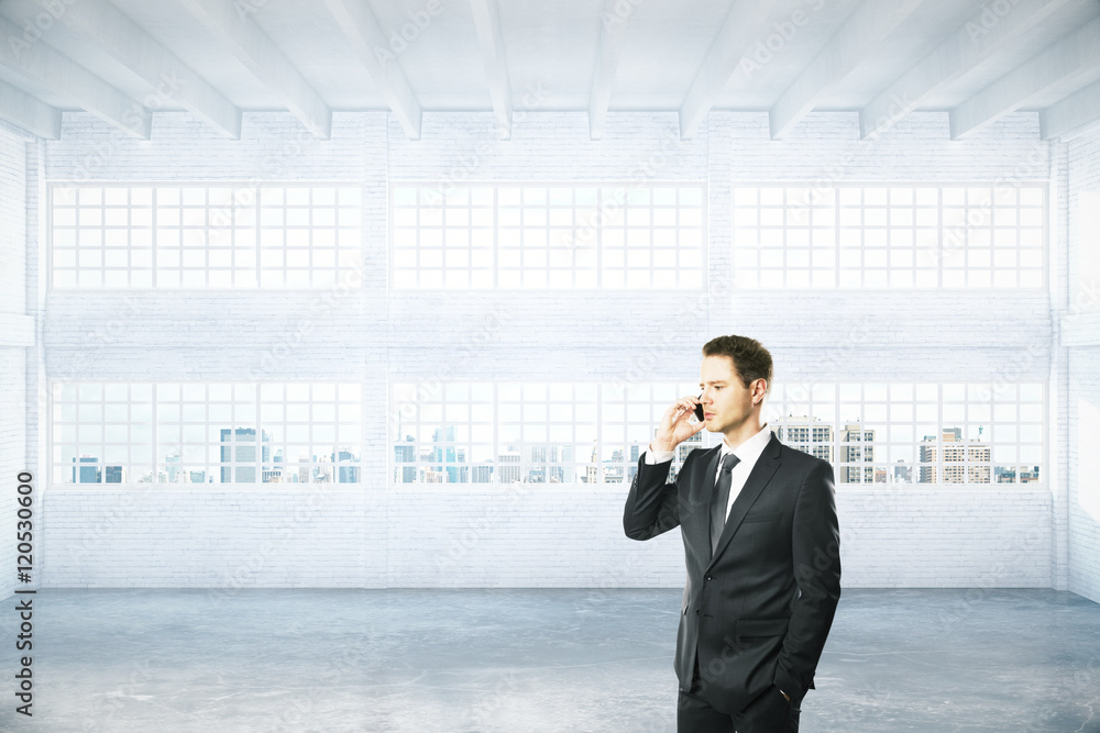 Man on phone in hangar