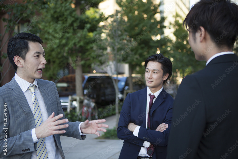 Businessman who has been the stand talking in the office district