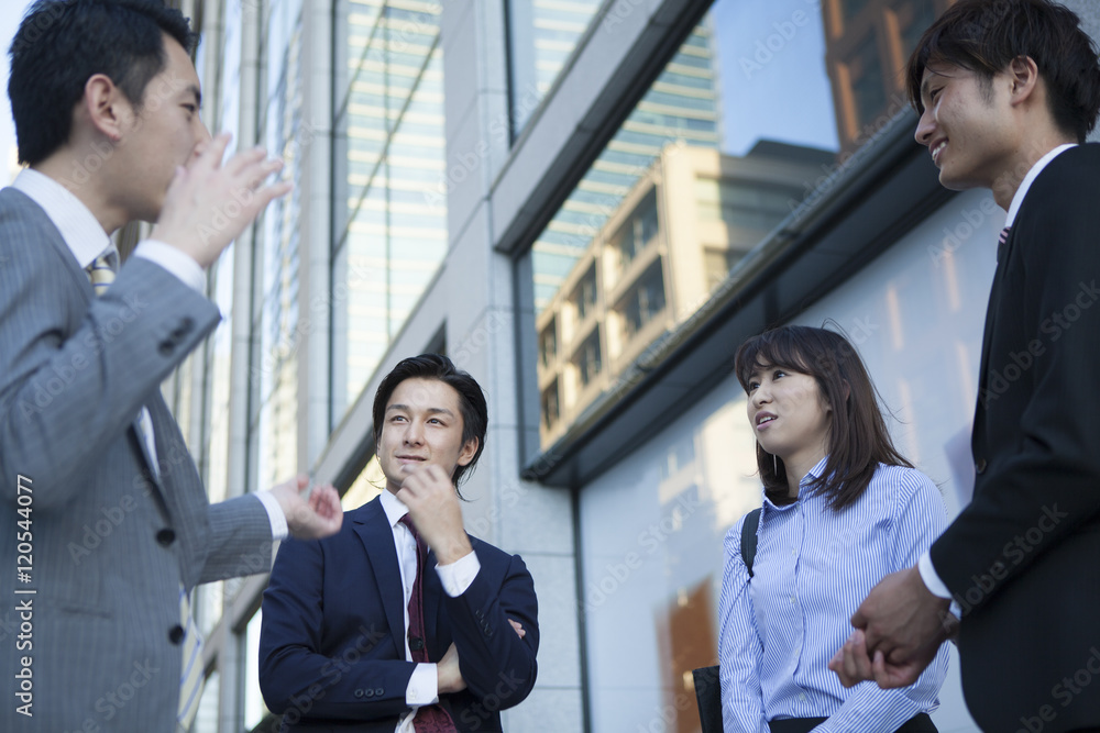 Businessman who has been the stand talking in the office district