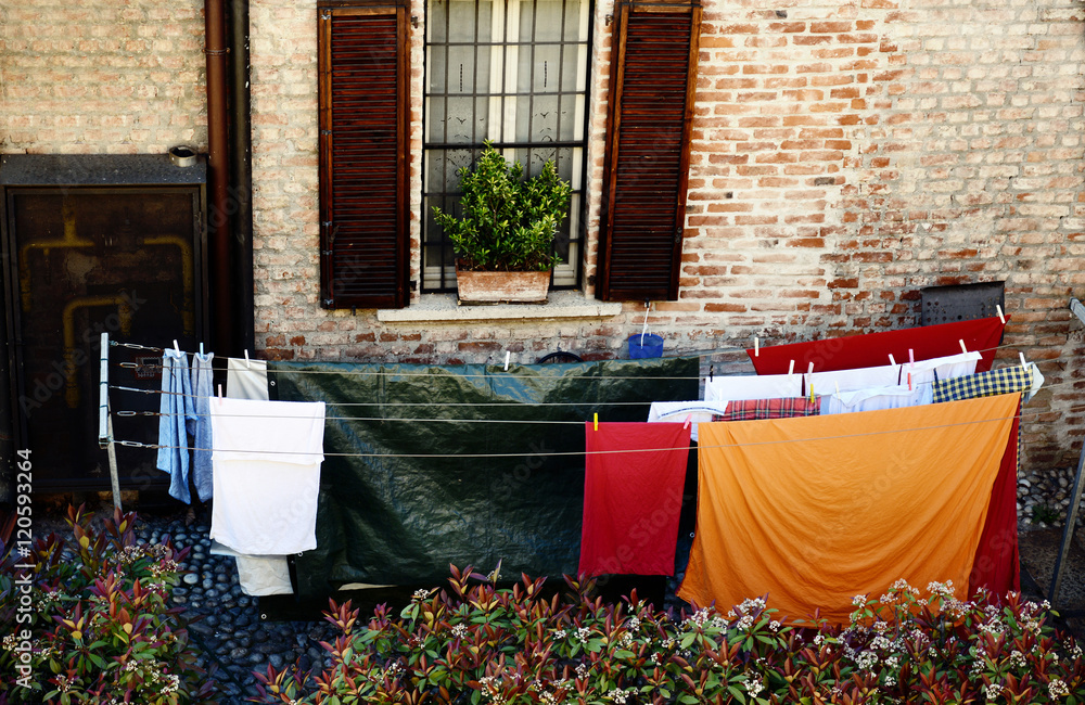 colorful clothes hanging in the old farm