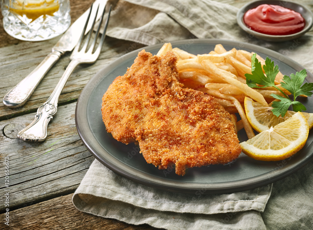 pork schnitzel and fried potatoes