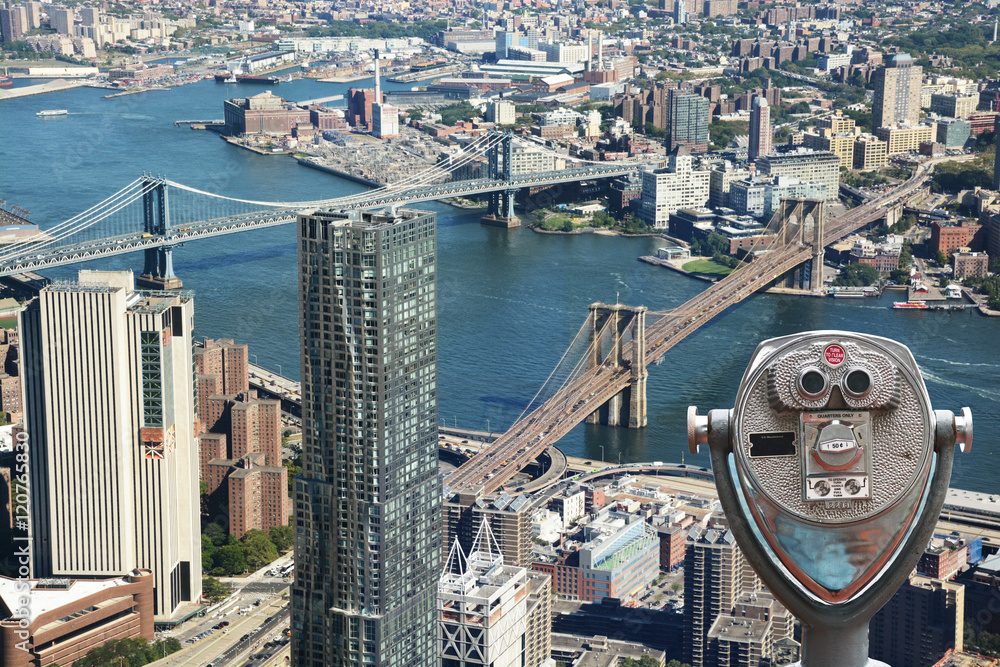 Sightseeing telescope against Brooklyn Bridge and Manhattan Bridge, New York City, USA