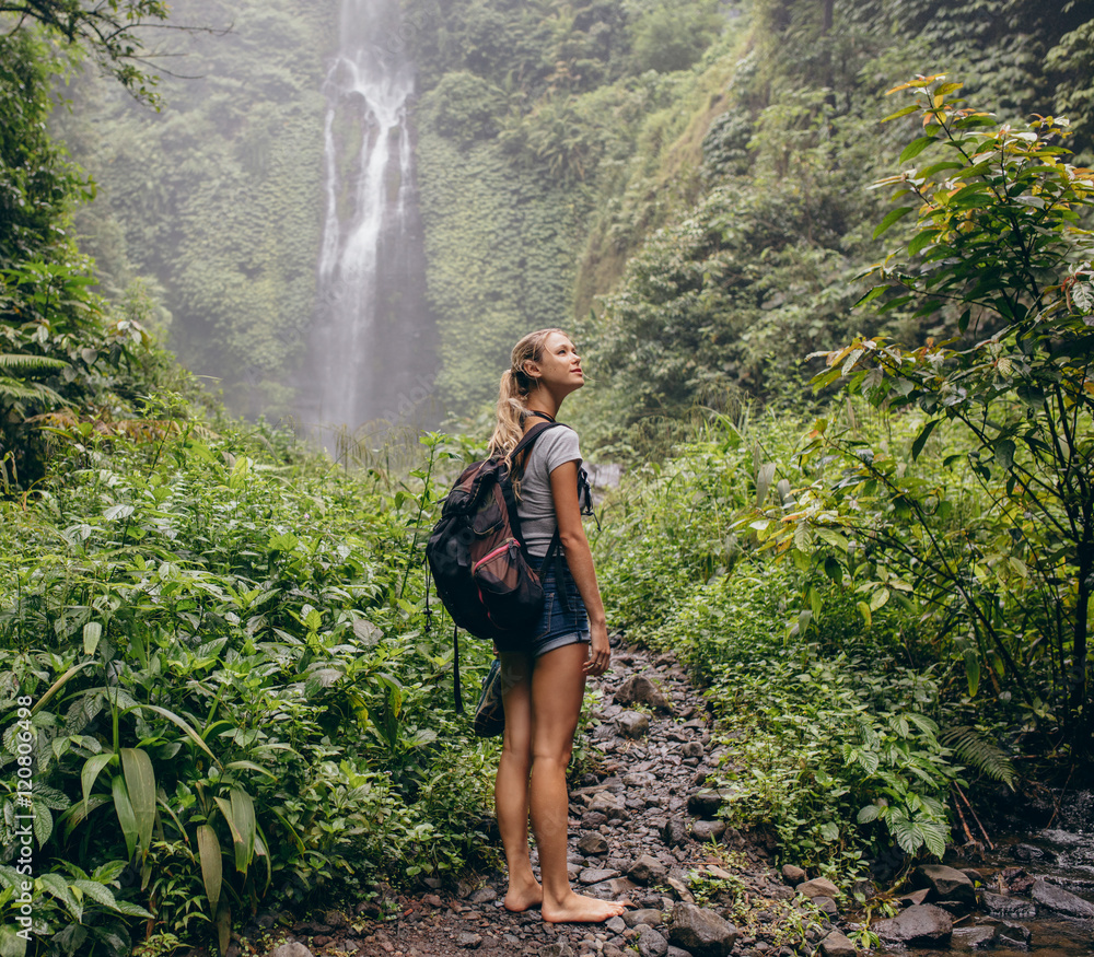 Beautiful woman hiker on forest trail