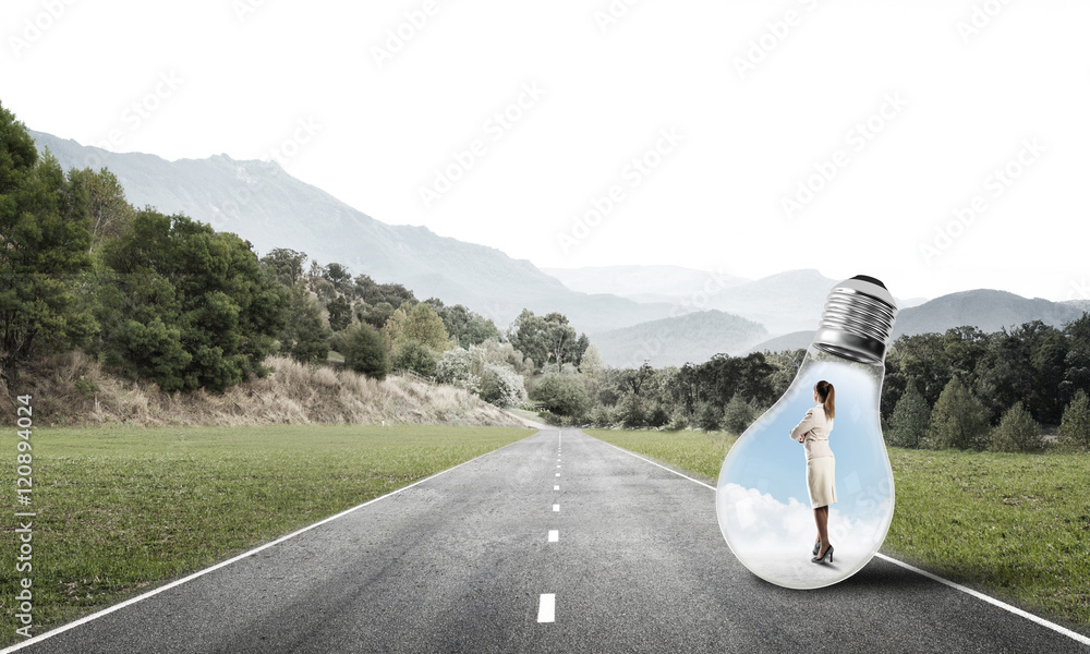 Businesswoman inside light bulb