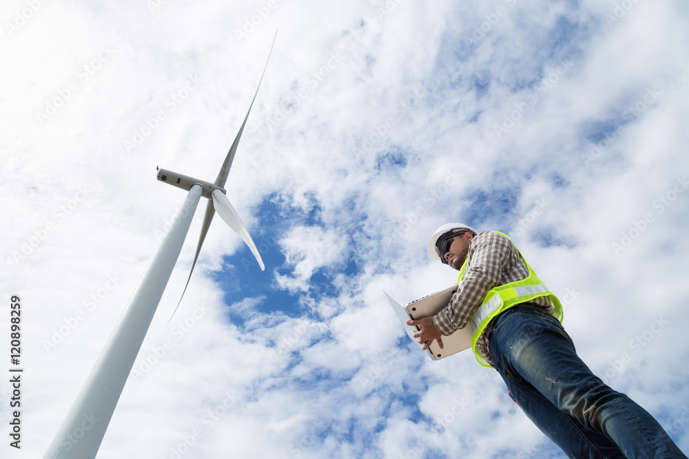 Engineers working at wind turbine power generator station