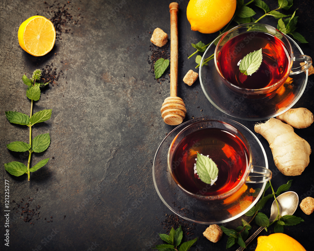 Hot tea cups with mint, lemon and sugar