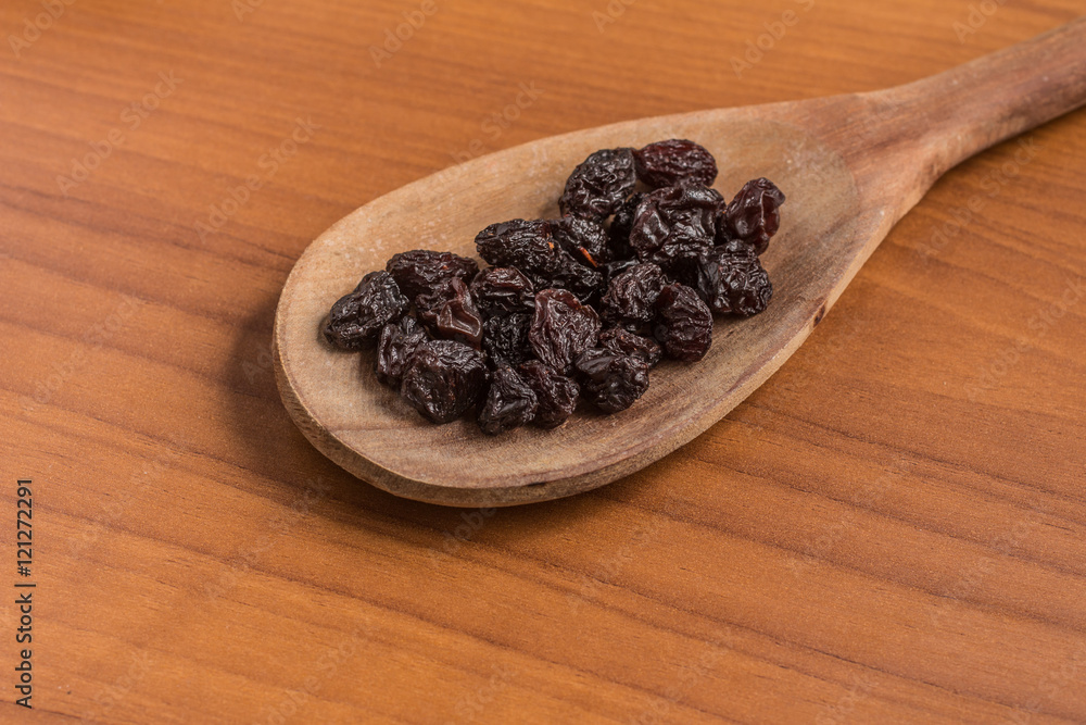 Dried Grapes into a spoon