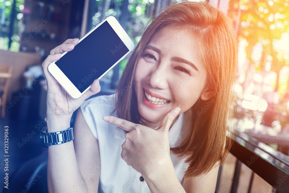 beauty asian girl smiling and showing smartphone