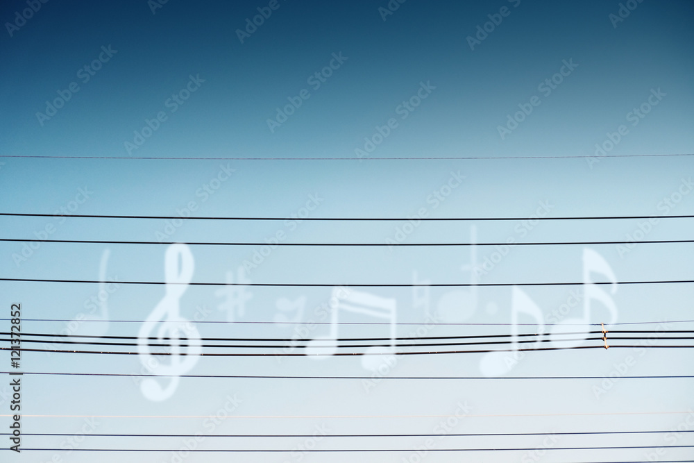 Blurred Music Note on the Cable Wire with Blue Sky background