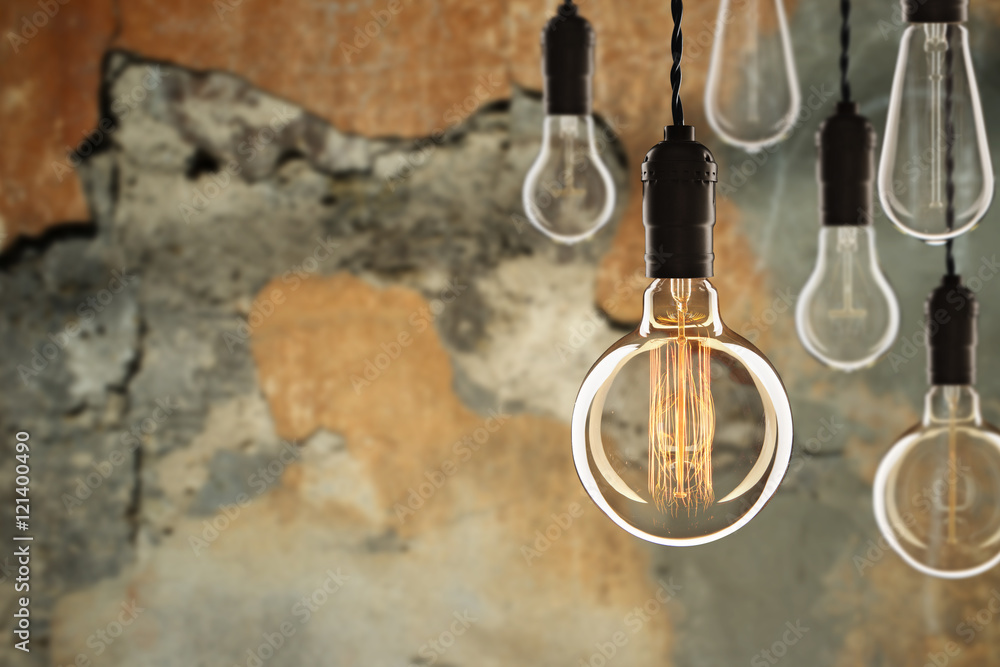 Idea and leadership concept Vintage incandescent Edison bulbs on