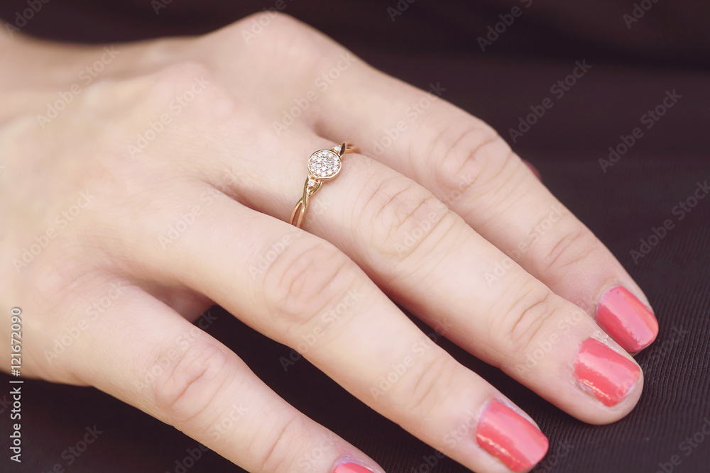 womans hand with beautiful engagement ring