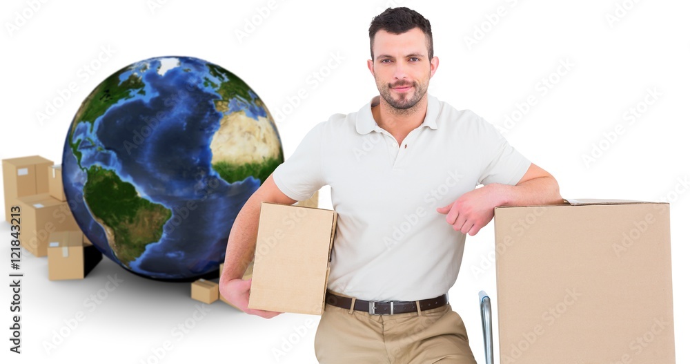 Composite image of delivery man with trolley of boxes 