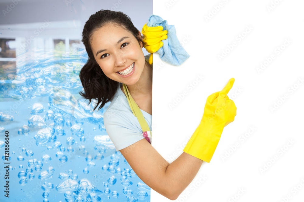 Woman in rubber gloves pointing to the white 