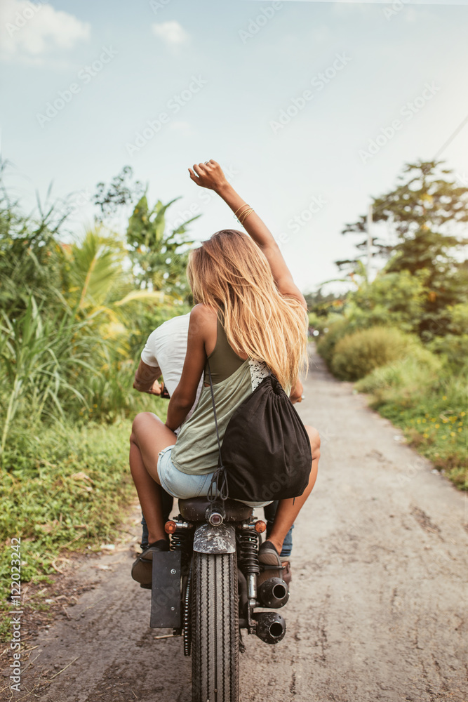 Young couple enjoying motorbike ride