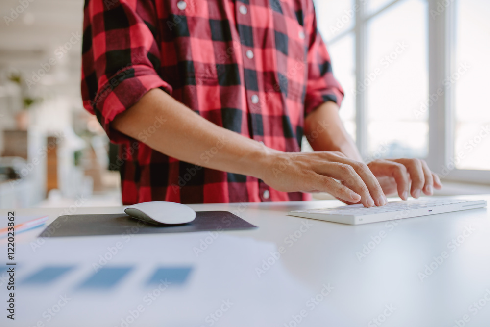 Man hands typing on computer keyboard