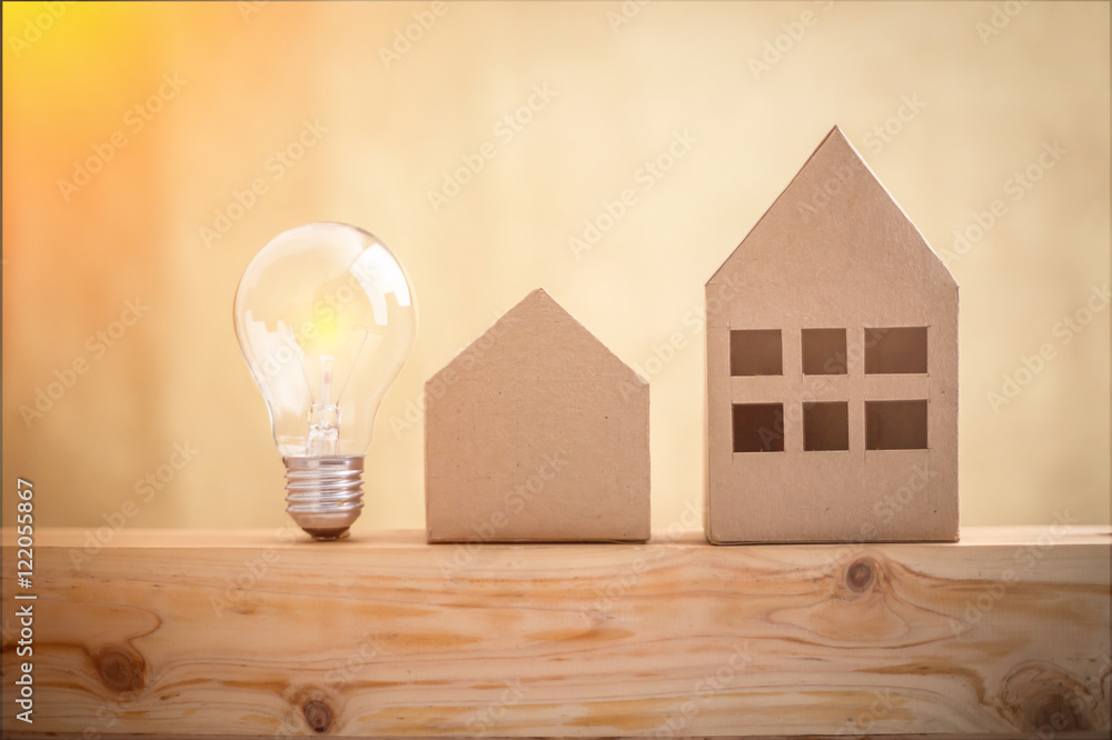 paper houses stands over a wooden background