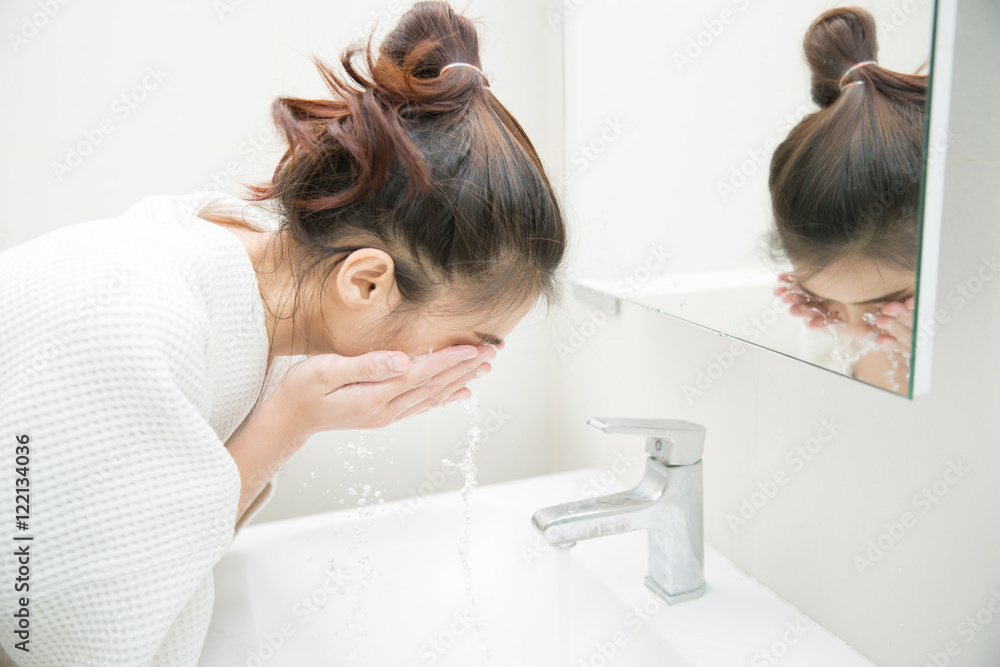 Woman wakes from sleep and she was cleansing the morning before shower